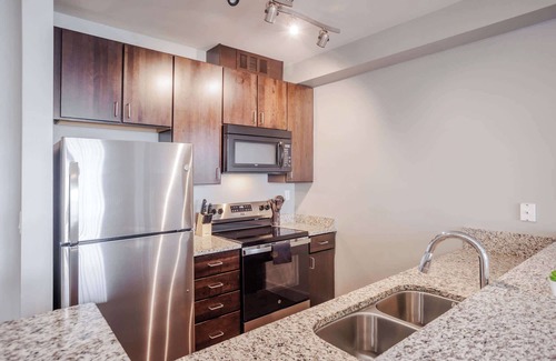 Central Business District Apartment | CozySuites at the Banks gym, pool 09