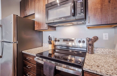 Central Business District Apartment | CozySuites at the Banks gym, pool 09