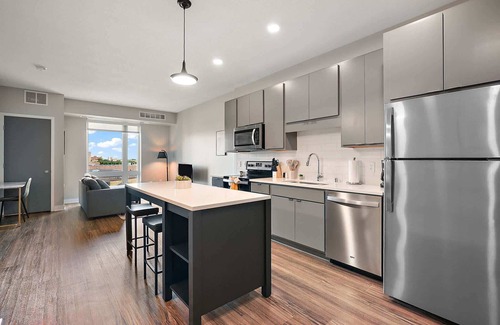 Downtown Minneapolis Apartment | CozySuites Marquee | pool, gym #10