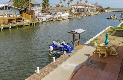 City-by-the Sea House | Crazy about fishing? Check out this home on deep canal near Estes Flats, Redfish Bay, and the Intracoastal Waterway!