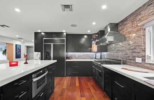 Harbour Inlet House | Custom remodeled home with tropical setting in exclusive Harbor Inlet community