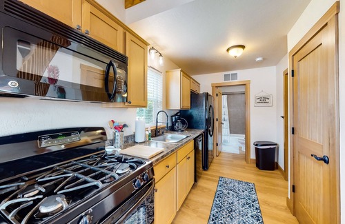 Dover Bay House | Cute, dog-friendly cabin with a large patio & fireplace - walk to river beach