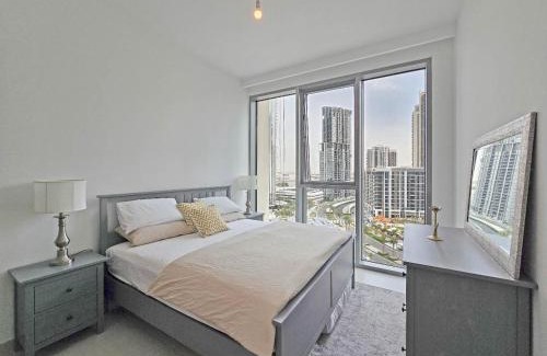 Dubai Apartment | Deluxe 1-Bedroom in The Grand - Waterfront and Skyline Views