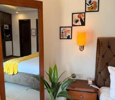 Islamabad Apartment | Deluxe King with Sunset Yellow Hues in Bahria Phase 4 Islamabad