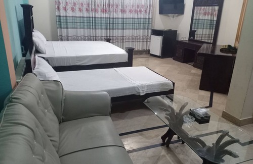 G-8 Sector House | Deluxe room with extra single bed