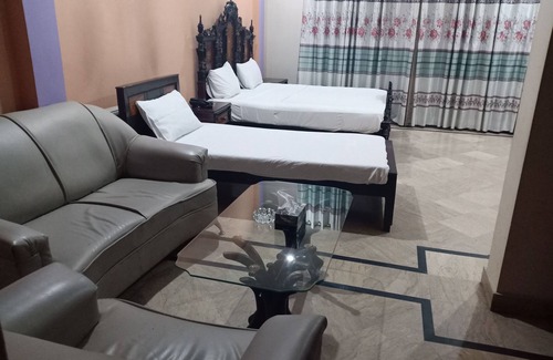 G-8 Sector House | Deluxe room with extra single bed