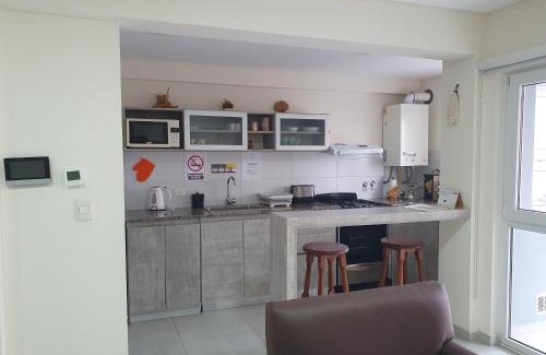 Puerto Madryn Apartment | Departamento Sorken - cochera cubierta, terraza con parrilla