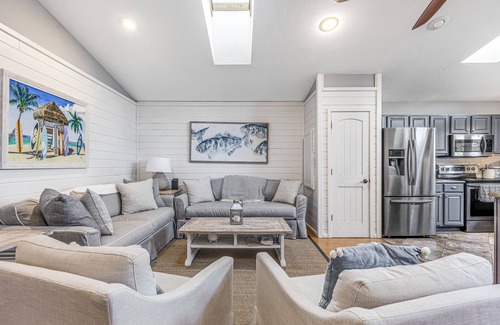 Rehoboth by the Sea House | Dewey Beach home with enclosed lanai, hot tub, patio & firepit - 1 dog welcome