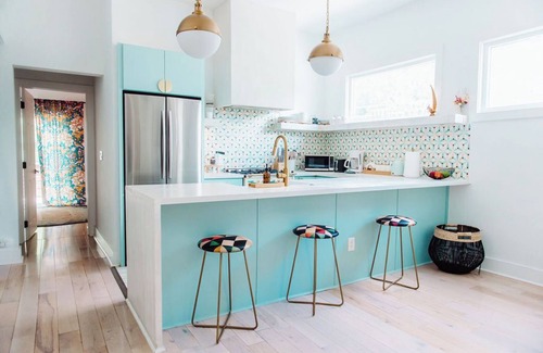 Midtown Apartment | Discover Ponce Hideaway—an elegant 2BR, 2.5BA retreat in Midtown Atlanta. Modern-eclectic design, gold accents, and jewel tones set the scene. Enjoy a private patio, full kitchen, washer/dryer, & walkable access to Ponce City Market and Piedmont Park