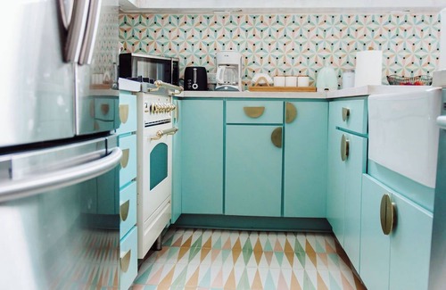 Midtown Apartment | Discover Ponce Hideaway—an elegant 2BR, 2.5BA retreat in Midtown Atlanta. Modern-eclectic design, gold accents, and jewel tones set the scene. Enjoy a private patio, full kitchen, washer/dryer, & walkable access to Ponce City Market and Piedmont Park