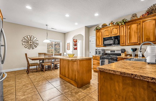 Moab South Valley House | Dog-friendly, mountain view home with private hot tub, central AC, and fireplace