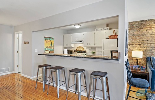 Lake Geneva Apartment | Downtown Lake Geneva-Chicago |Above Shops on Main |Onsite Parking |Fun Themed Urban Apartment |King