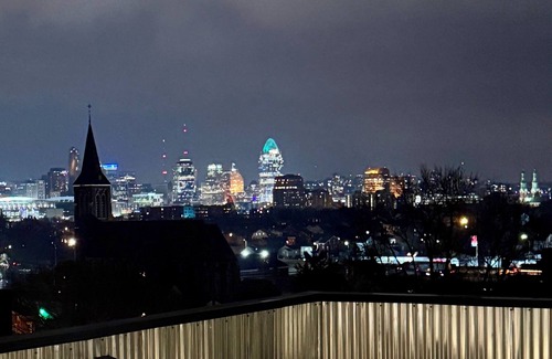 Covington House | Downtown skyline view featuring giant rooftop deck & wet bar with a city view.