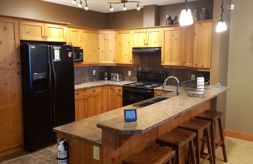 Snow Pine Estates Condo | Easy access Ski out condo with Hot Tub! Pet friendly.