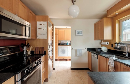 Rainier Valley House | Eclectic Redbrick Rambler near Japanese Gardens