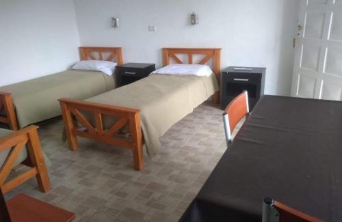 Comandante Luis Piedrabuena Apartment | El Mastil Departamentos Dormis Habitaciones