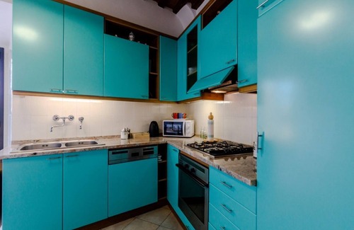 Siena City Centre Apartment | Elegant 120 sqm apartment for 6 people, located on the first floor of a historic residence without an elevator, adjacent to Porta di San Maurizio, on the ancient 13th-century walls. Featuring a spacious terrace, the accommodation is in the city center, j