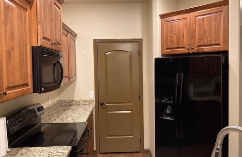 Cedar City House | Elegant Cedar Ridge Escape with clubhouse amenities - pool, hot tub, gym, grill.