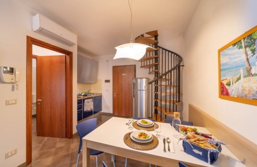 Bibione Apartment | Elegant duplex apartment with shared pool