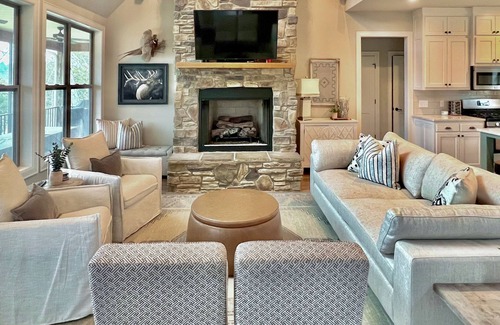 Rogers House | Elegant lakefront home with a fireplace, screened patio & lovely views