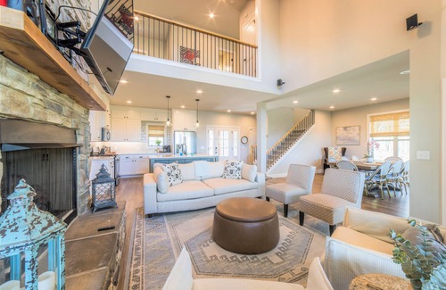 Rogers House | Elegant lakefront home with a fireplace, screened patio & lovely views