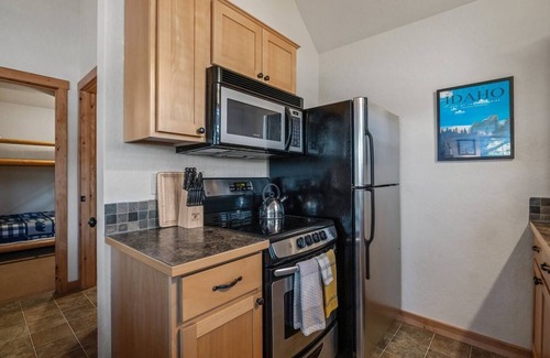 Dover House | Embrace lakeside serenity at this cozy Dover Bay bungalow, just steps from the water, perfect for couples or families seeking peaceful Idaho charm.