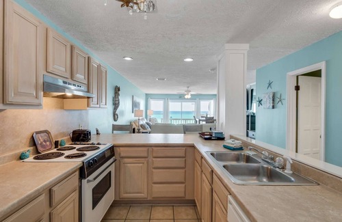 West Panama City Beach House | Emerald Winds 2BR/2.5BA Beach Townhome Directly on the Beach Located Near Pier Park!
