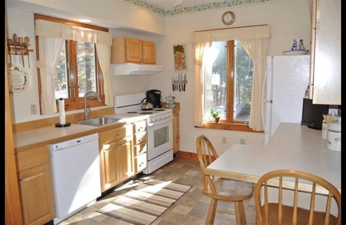 Gilmanton IW House | Enjoy lakefront life. Sleeps 12+. Gorgeous sunsets year-round on Crystal Lake