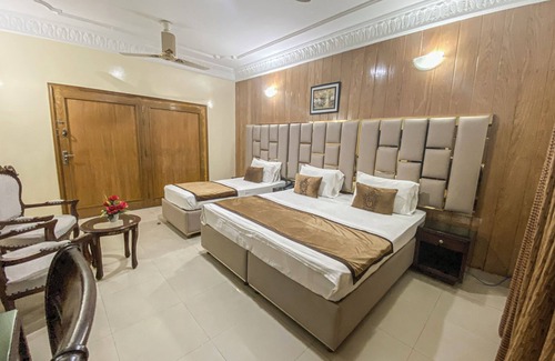 D.H.A. Hotel | Executive Triplet Room with One King and One Single Beds, Fully Equipped!