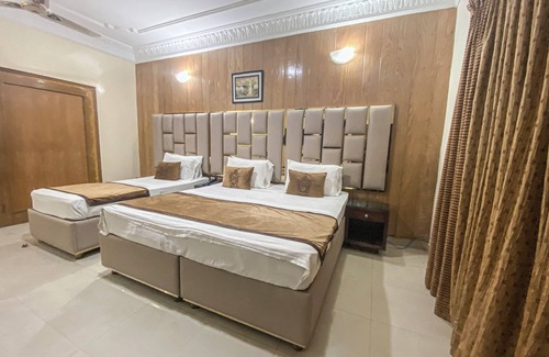 D.H.A. Hotel | Executive Triplet Room with One King and One Single Beds, Fully Equipped!