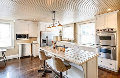 Tazewell House | Experience the vibrant Nelle May Room at the historic Litz Mansion in Tazewell, VA