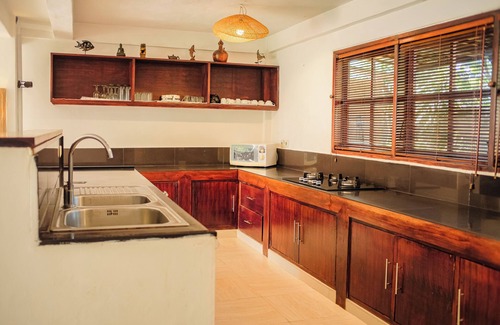 Dencarik Villa | Fabulous villa right on the beach with large pool, tropical garden & staff