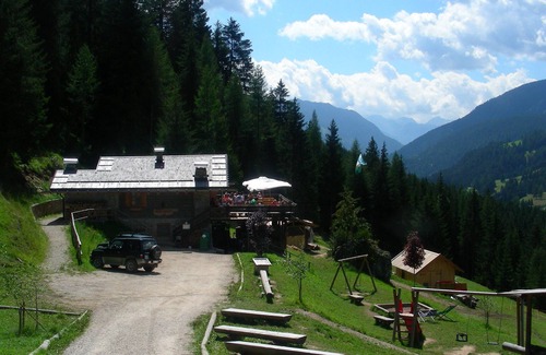 San Giovanni di Fassa Apartment | Facing the ski slopes, a stone's throw from the cable car departure for the sellaronda