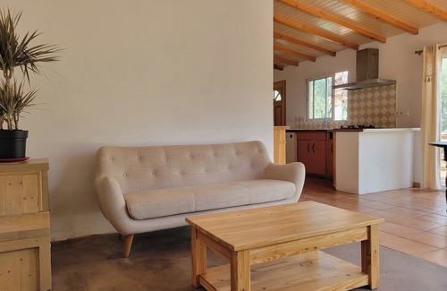 Osani House | Family home with whirlpool bath, facing the sea.
