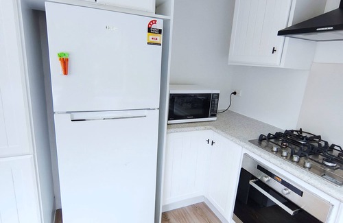 Glenfield House | Family room with door lock and self bathroom with bush view