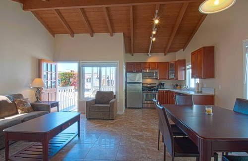 West Newport Condo | Fantastic and newly-remodeled upper unit just one house from the warm sand