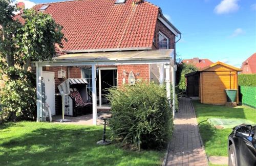 Neßmersiel House | Ferienhaus Huus Wattenmeer in Nessmersiel mit Garten, Terrasse, Sauna, Räder, und Grill