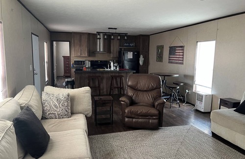 Hackberry House | Fishing camp with boat stall cleaning table three bedroom two bath