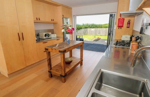 Carew Newton Cottage | FRESH WINDS, pet friendly, with open fire in Carew
