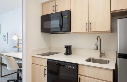 Westshore Hotel | Fully Equipped Kitchen in Modern Suite with Airport Shuttle and Swimming Pool