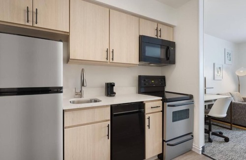 Westshore Hotel | Fully Equipped Kitchen in Modern Suite with Airport Shuttle and Swimming Pool