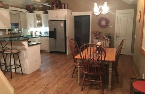 Spencer House | Gas fireplace, firepit, and cedar Adirondack chair