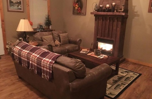 Spencer House | Gas fireplace, firepit, and cedar Adirondack chair