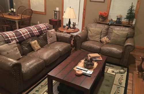 Spencer House | Gas fireplace, firepit, and cedar Adirondack chair