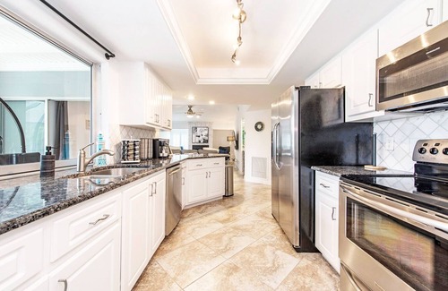 Palm River Estates House | Gorgeous Heated Pool and Hot Tub Home!