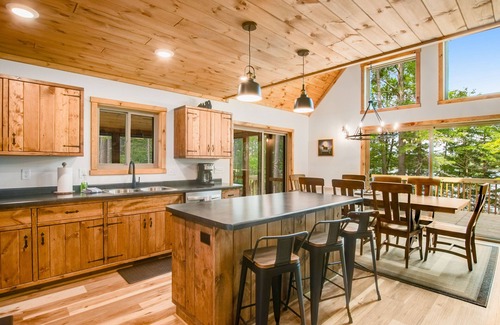 Eagle River House | Gorgeous lake home with private pier, beach, firepit, deck, & grill + water toys