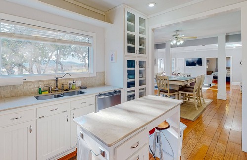 Holiday Island House | Gorgeous water view home with a fireplace, outdoor space & central AC