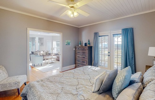 Holiday Island House | Gorgeous water view home with a fireplace, outdoor space & central AC