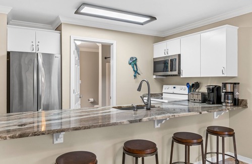 Fort Walton Beach - Destin Condo | Ground Floor Getaway in Destin! Beach Service Included! Pool! Hot Tub!