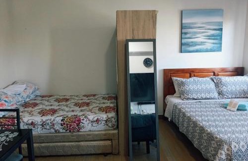 Trece Martires Hotel | Happy Stays A - 300mbps - 65"TV NetFlix, Disney - Washer